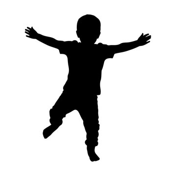 A joyful child jumping in the air with arms outstretched in silhouette