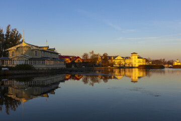 Fototapeta premium Historic town reflected in calm water at sunrise, Haapsalu Estonia