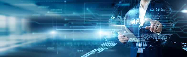 Fototapeta premium Software architect hand hold tablet and softly touch API endpoints. Connecting diverse systems and facilitating smooth data exchange. Efficient software integration via these modern tools.