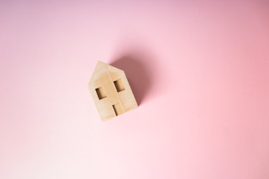 Aerial View of a House on a Solid Pink Background, Minimalist Real Estate Concept