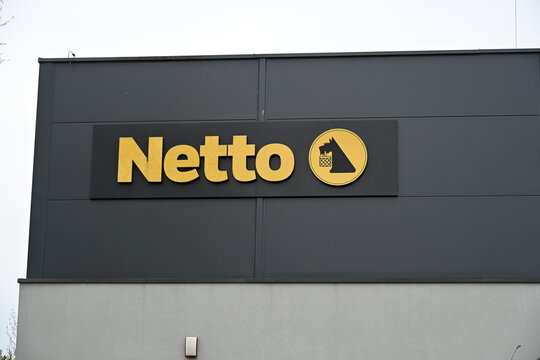 Netto Store Facade with Logo Signage on Retail Building
