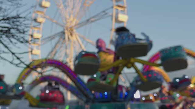 Nighttime glowing roller coaster rides. Vibrant night amusement park filled with dazzling spinning attractions. Brightly lit fairground featuring captivating luminous rides and swirling entertainment