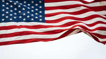 Obraz premium American flag waving in the wind with red white and blue colors and fifty white stars on a clear sky