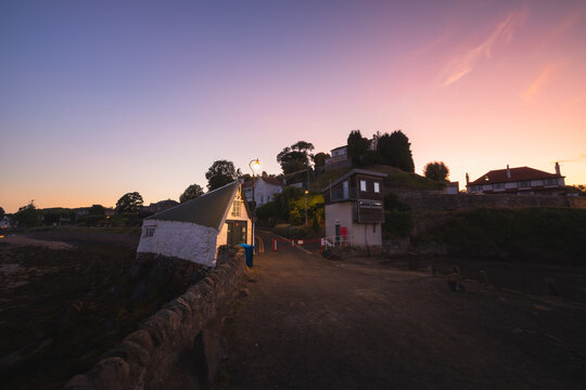 Scenic, picturesque view of at of the seaside coastal village of Aberdour during a summer sunset in Fife, Scotland, UK.
