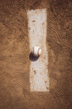 Baseball on pitcher's mound and infield dirt