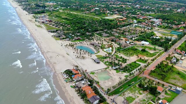 Aerial Drone View of Tropical Beach Resort with Lagoon and Palm Trees in Northeast Brazil