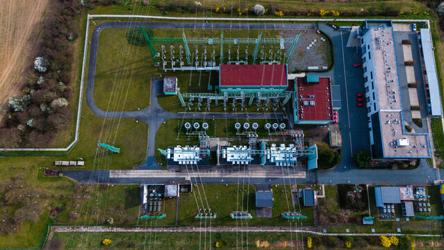 Aerial view of an electrical substation's geometric precision against the backdrop of fields, Praha-Seberov, Hlavni mesto Praha, Czechia.