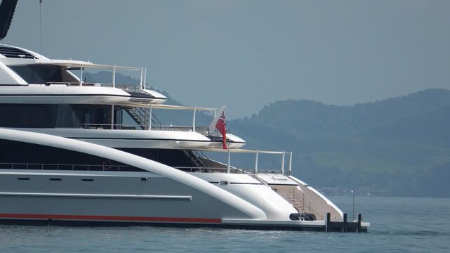 Huge motor mega yacht in a tropical landscape, luxury private motor yacht in the tropics