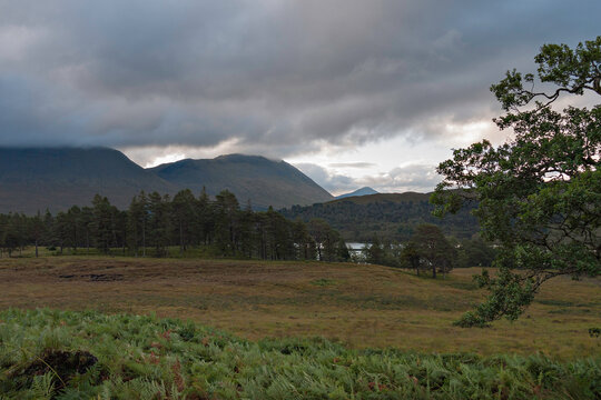 The view south-east from the West Highland Way on Rannoch Moor, north of Forest Lodge gives a glimpse of Loch Tulla and on to the Bridge of Orchy mountains. Argyll, Scottish Highlands.