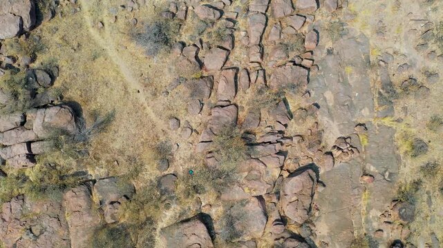 Top-Down Aerial View of Arid Rocky Terrain in Molepolole scattered boulders, dry scrub