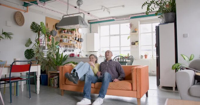 Young Adult Couple Carrying Sofa at Home, Decorating, moving in, Roommates