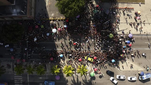 Drone Footage, Aerial View in Zenital mode of Carnival block parade in the middle of the street of Rio de Janeiro, Brazil
