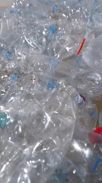 Crushed transparent PET bottles waste problem and recycling industry