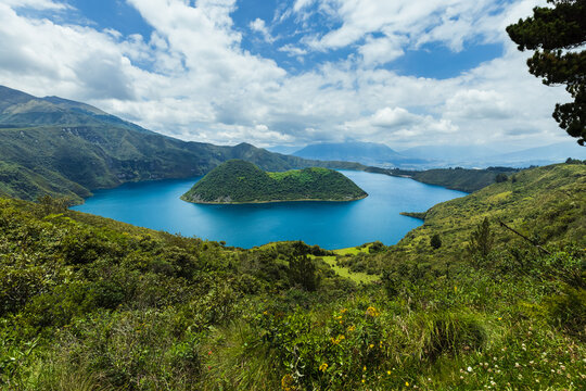 Cuicocha Crater Lake with volcanic islands in Cotacachi, Imbabura, Ecuador. Stunning Andean landscape with blue water and lush green mountains.