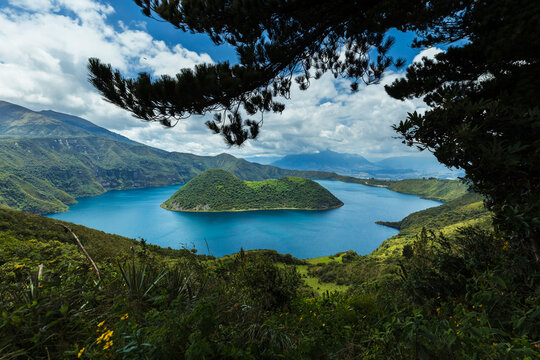 Cuicocha Crater Lake with volcanic islands in Cotacachi, Imbabura, Ecuador. Stunning Andean landscape with blue water and lush green mountains.