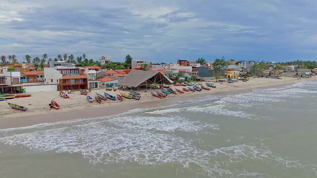 Aerial View from the Sea of a Colorful Brazilian Fishing Village with Boats on the Shore