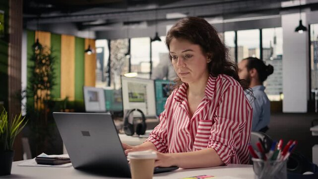 Portrait of businesswoman inside open space office environment, creative agency staff planning strategy for development and management. Employee consultant in smart office corporation.
