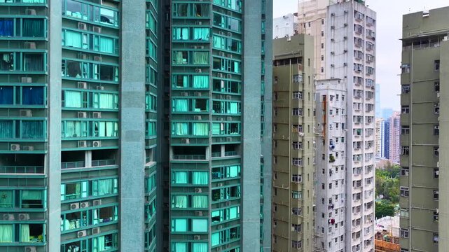 Sai Ying Pun and Kennedy Town drone shot of traditional heritage sites mixed with modern luxury skyscrapers along the Victoria Harbour waterfront in Western District Hong Kong
