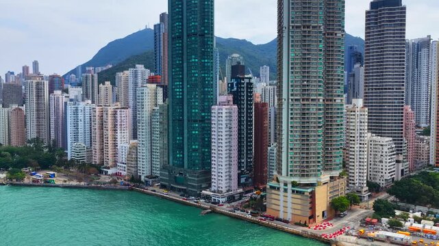 Sai Ying Pun and Kennedy Town drone shot of traditional heritage sites mixed with modern luxury skyscrapers along the Victoria Harbour waterfront in Western District Hong Kong