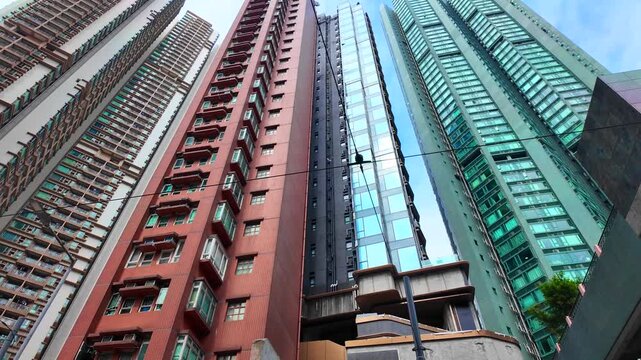 Sai Ying Pun and Kennedy Town drone shot of traditional heritage sites mixed with modern luxury skyscrapers along the Victoria Harbour waterfront in Western District Hong Kong