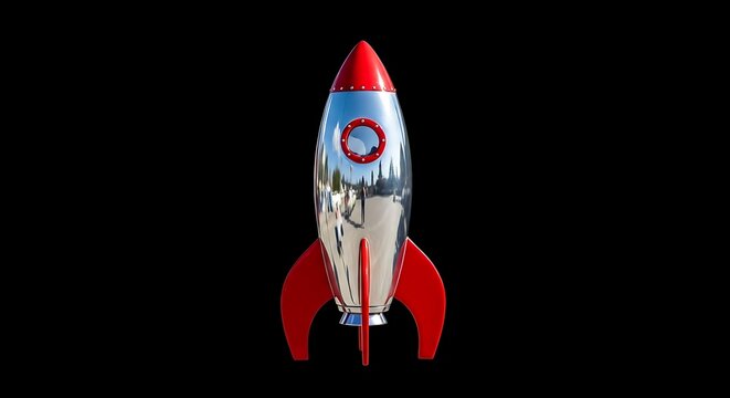 A shiny silver toy rocket with red fins and nose sits against a stark black backdrop