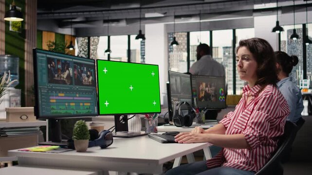 Chroma key and cinematic film footage with woman video editor on computer in production studio. Screen shows raw clips, cutting tools and motion graphics visual effects in movie post production.