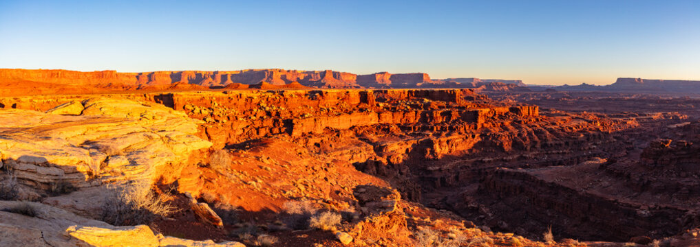 This scenic sunrise panorama of Canyonlands National Park near Moab, Utah, was captured from deep within the park.