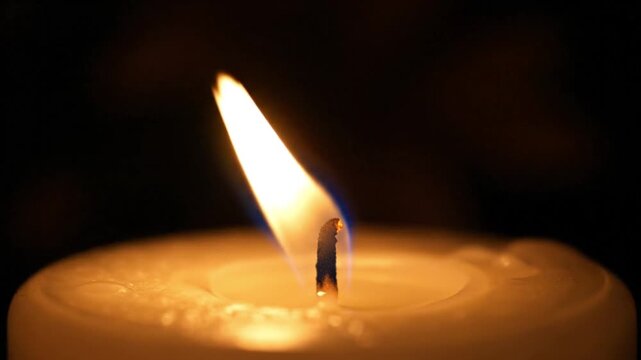 Intimate Candle Flame Shimmer In Dim Night.