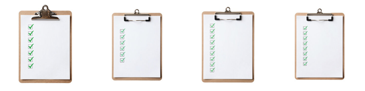 Various clipboards with sheets of paper and checkmarks organized on a black backdrop