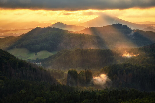 Sun rays over hills in the Luzicke hory