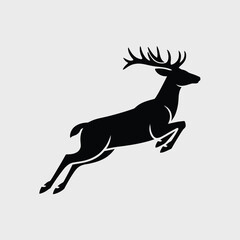 Obraz premium A majestic black silhouette of a leaping stag against a neutral background
