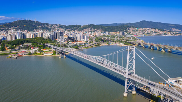 Herc&iacute;lio Luz Bridge in Florianopolis Brazil spanning blue bay waters under clear sky.