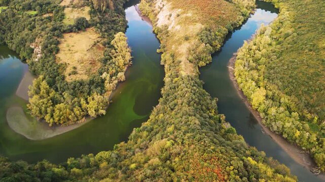 Aerial rising reveal of Meandros del Nora horseshoe bend. Cinematic 4K ProRes 422 drone footage of a river meander in Asturias, Spain.