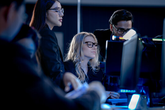 Building tomorrow AI tonight deep focus diverse engineers code train complex models multi screen setup innovation lab intense collaboration future tech taking shape now project crunch.