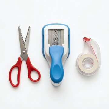 A set of office supplies including scissors, a tape dispenser, and correction tape on a white background.