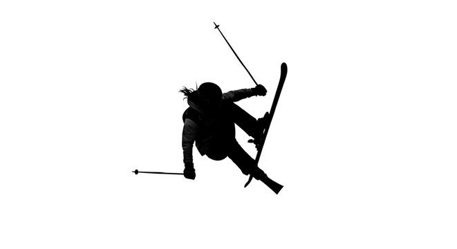 A silhouette of a skier in mid-air, performing a daring stunt on a snowy slope