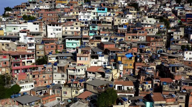 Drone Footage, Aerial View close up of Favela Houses from Morro do Vidigal in Rio de Janeiro, Brazil