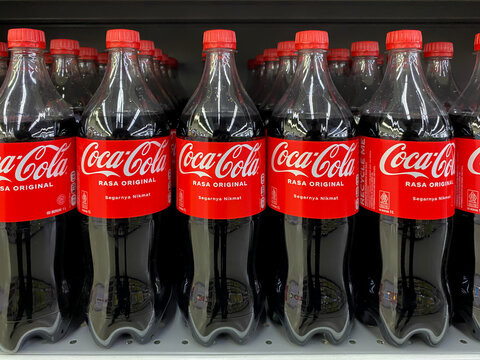 Batam, Indonesia - April 2026: Coca-Cola beverages arranged on supermarket shelves inside Hypermart store showing retail product display and beverage section.