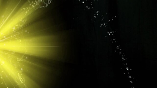 Bright yellow beam starting, translucent water sheet unrolling into droplets, showing fragmentation