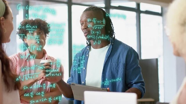 Man tapping tablet, gesturing, causing teal math expanding over team, visualizing tech concepts