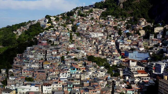 Drone Footage, Aerial View traveling out from Favela Houses of Morro do Vidigal in Rio de Janeiro