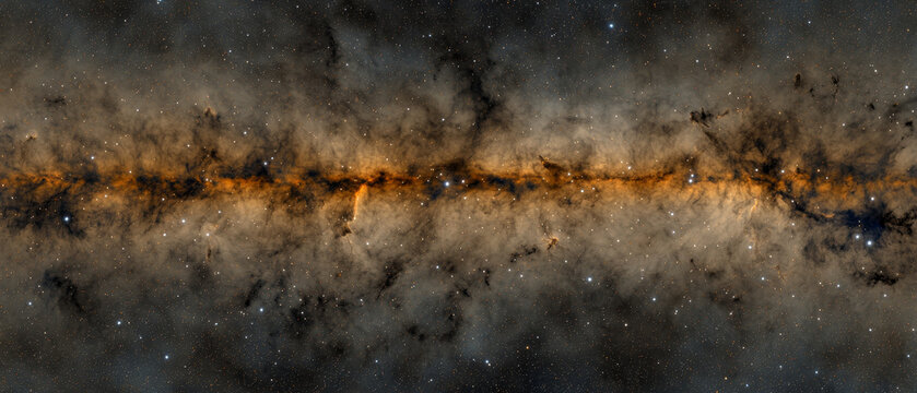 Cosmic panorama of a starry field featuring a central orange and dark dust lane with intricate nebulae and stellar formations