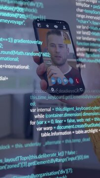 Vertical video: Mustard sleeve lifting phone showing man, code scrolling, enhancing call