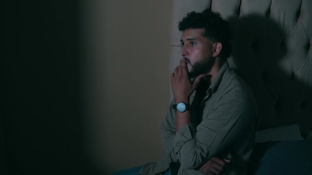 Stressed worried man at bedroom with insomnia and anxiety