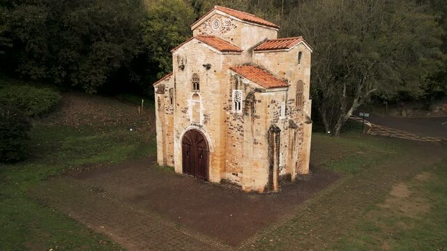 Aerial rising pull-away of San Miguel de Lillo church in Oviedo. Cinematic 4K ProRes 422 drone footage of UNESCO pre-Romanesque architecture.
