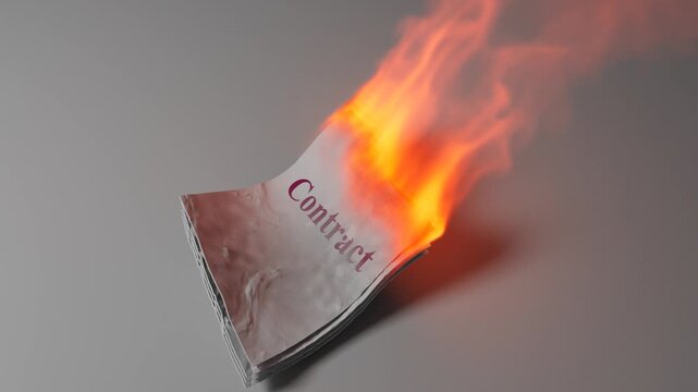 Contract Document Burning With Large Orange Visible Flames
