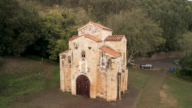 Aerial rising spiral pull-away of San Miguel de Lillo church. Cinematic 4K ProRes 422 drone footage of UNESCO heritage in Spain.