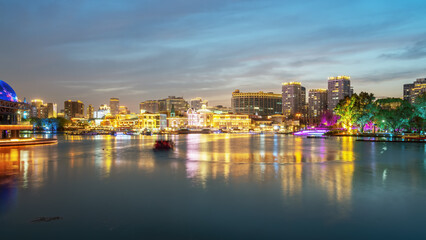 Obraz premium Night View of Modern City Waterfront with Lights