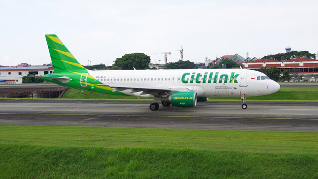 Ground level shot of Citilink low cost carrier airplane preparing for takeoff on April 14, 2026 in Soekarno-Hatta Interational Airport, Jakarta, Indonesia.