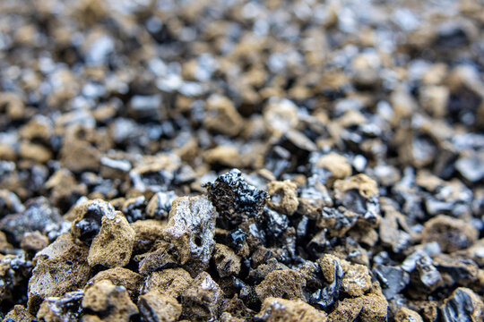 Extreme close up of porous volcanic scoria and lapilli on the ground at Hawaii Volcanoes National Park on the Big Island of Hawaii